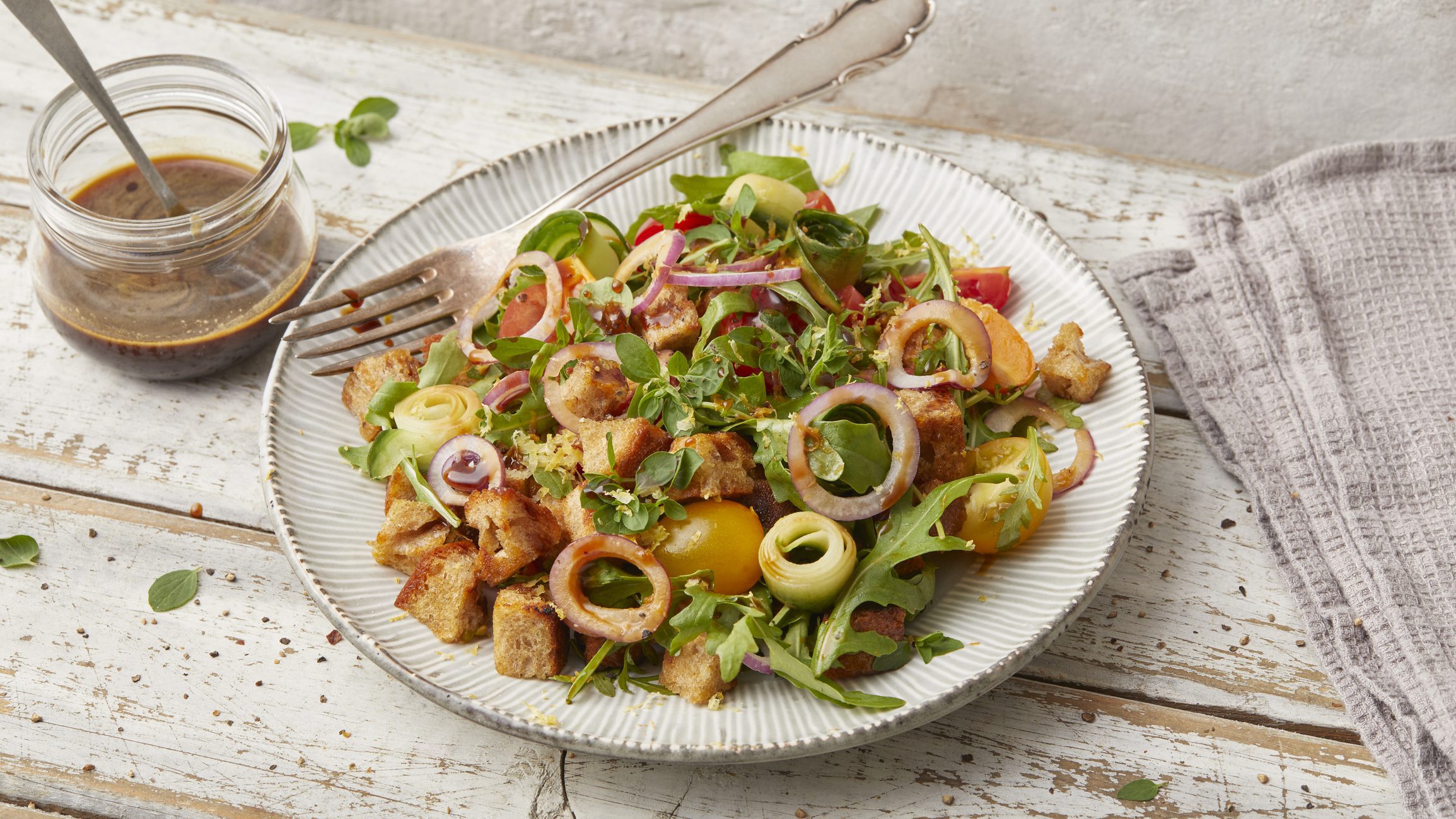 Fresh mixed salad with egg yolk and croutons
